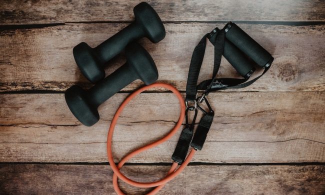 Pair of dumbbells and a resistance band with handles.