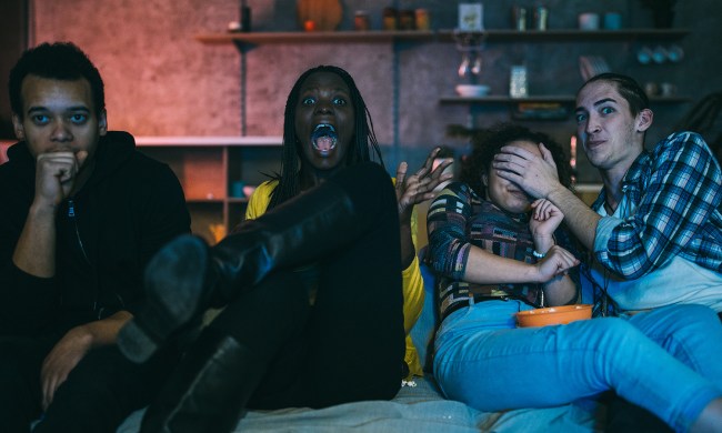 Horror movie scene watching at home